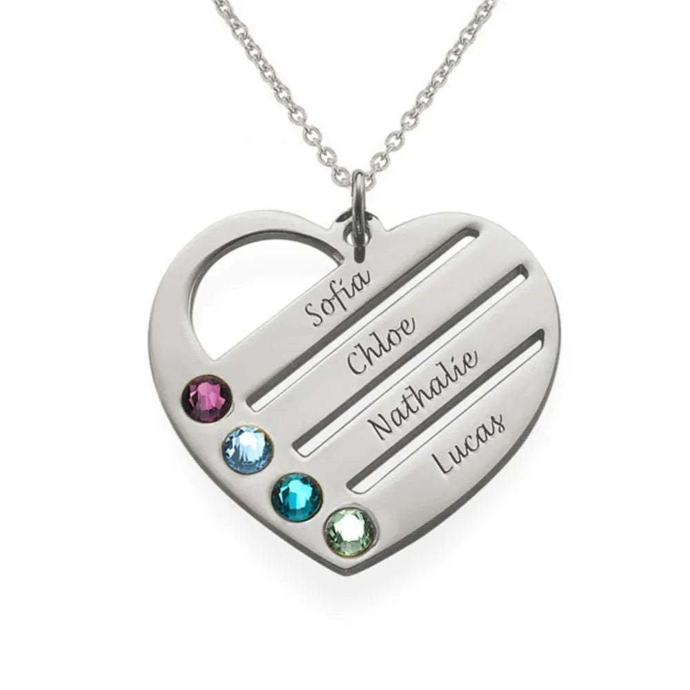 A silver heart-shaped necklace pendant engraved with the names “Sofia,” “Chloe,” “Nathalie,” and “Lucas,” featuring four colorful birthstones in purple, blue, teal, and green along one side.