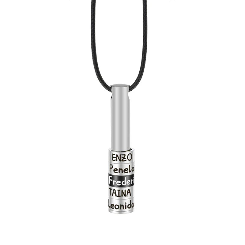 A Titanium steelmen’s necklace featuring a sleek cylindrical pendant engraved with multiple names, suspended on a black leather cord, symbolizing connection and modern minimalist style.