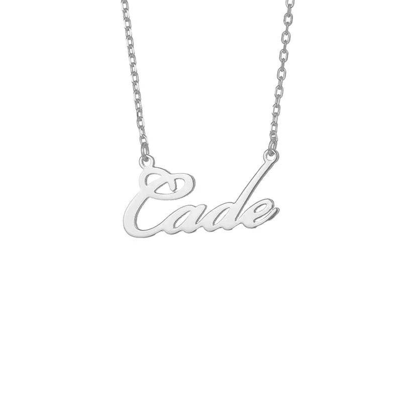A silver name necklace with the word “Cade” written in an elegant cursive font. The pendant is attached to a delicate silver chain on both sides, creating a sleek and stylish personalized jewelry piece.