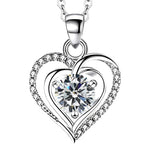 A silver heart-shaped necklace with a sparkling round gemstone at the center, accented with small crystals along the curves, symbolizing elegant love and devotion.