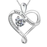 Silver heart-shaped pendant featuring an infinity design, a central round-cut gemstone, and engraved text that reads “love you forever,” displayed on a white background.