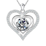 A silver double-heart necklace with a radiant round birthstone at the center, surrounded by shimmering crystals that symbolize eternal love and light.