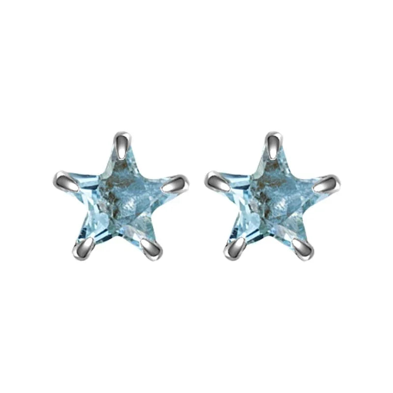 Star-shaped blue gemstone earrings on a white background
