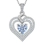 Heart-shaped silver pendant with a central blue gemstone on a white background