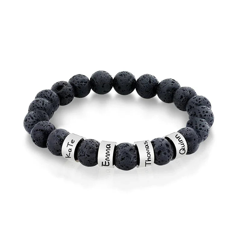 Black volcanic stone beaded bracelet with engraved silver name rings.