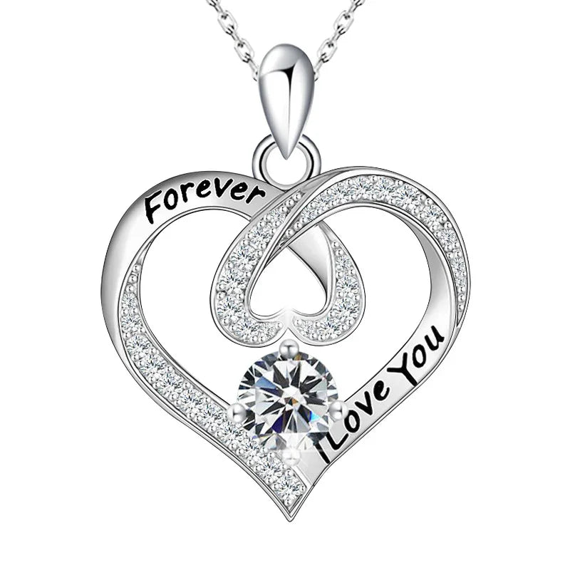 Silver heart-shaped pendant with 'Forever Love You' engraving on a white background