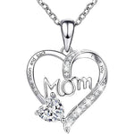 Silver necklace with heart-shaped pendant and 'Mom' engraving on a white background