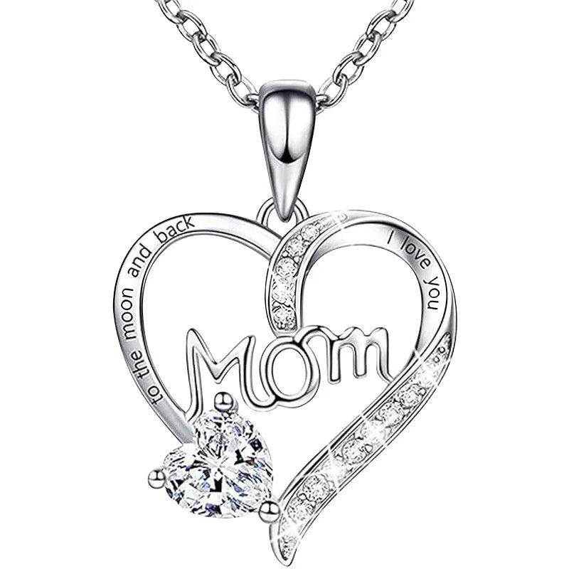Silver necklace with heart-shaped pendant and 'Mom' engraving on a white background