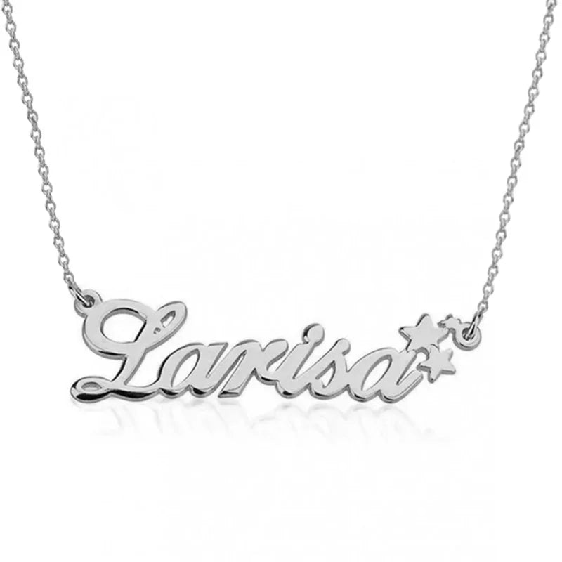 A silver personalized necklace featuring the name “Larisa” in cursive script with two small star accents at the end.